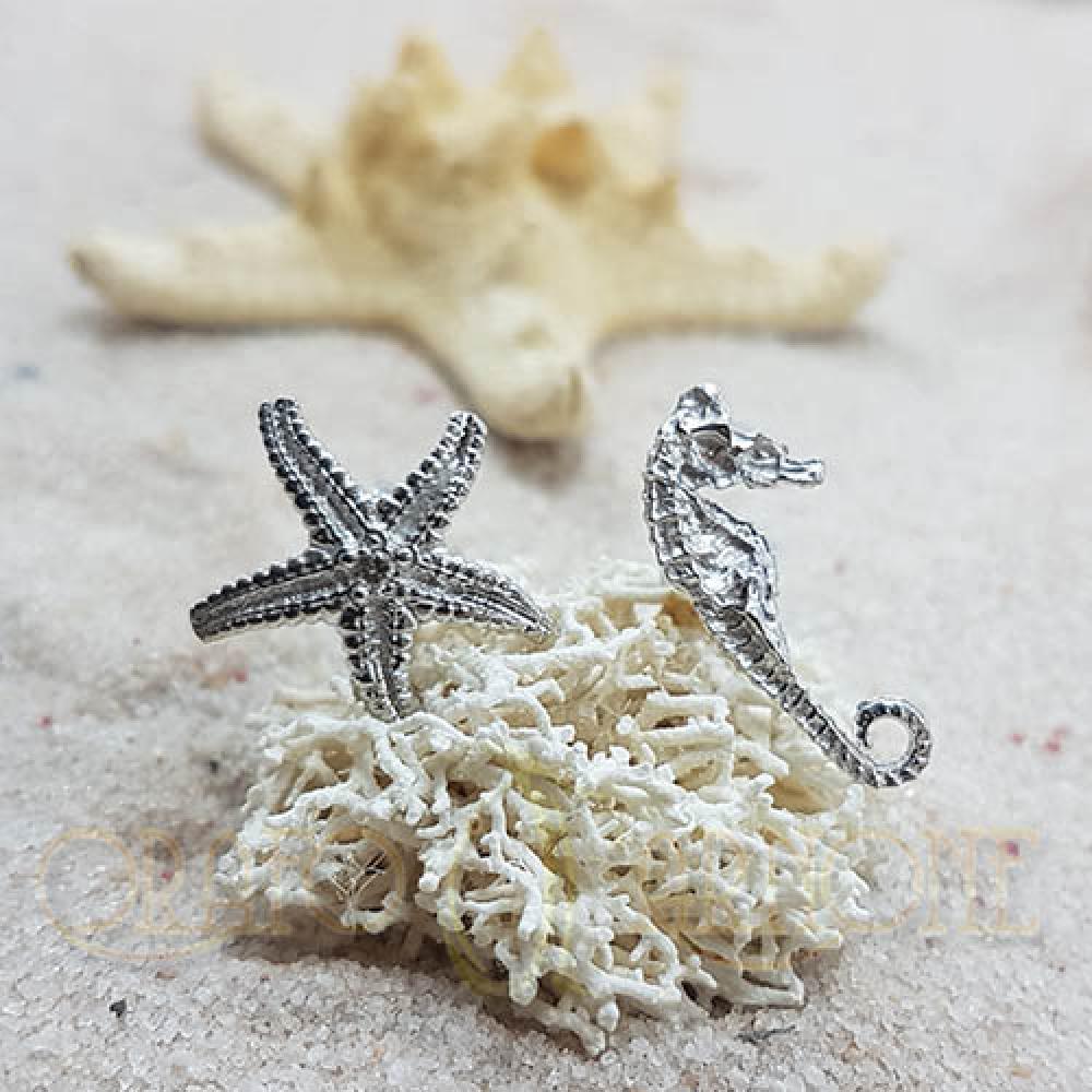 Orecchini cavalluccio e stella in oro con diamante